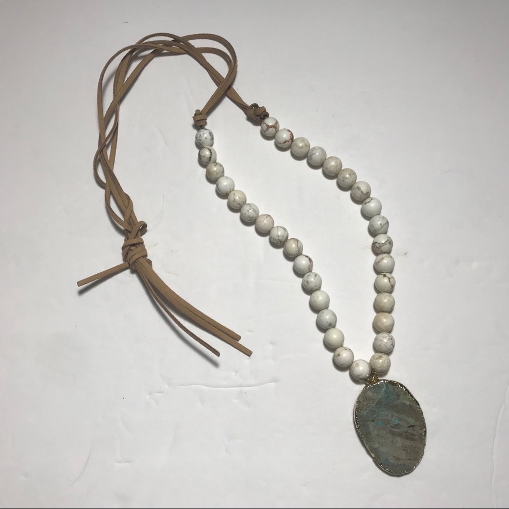 Gold trimmed stone, beads. Adjustable necklace.